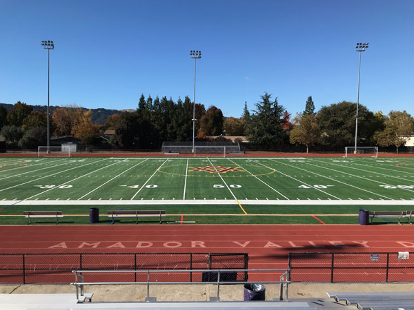 Amador Valley High School stadium: football field and red running track under a clear sky