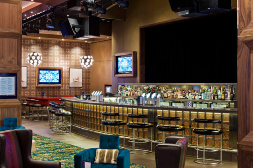 Crown Sports Bar with a backlit bar counter, bar stools, armchairs and TV screens