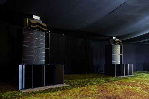 Two Pioneer Pro Audio loudspeaker stacks inside the black-draped fabric tent at Lovebox