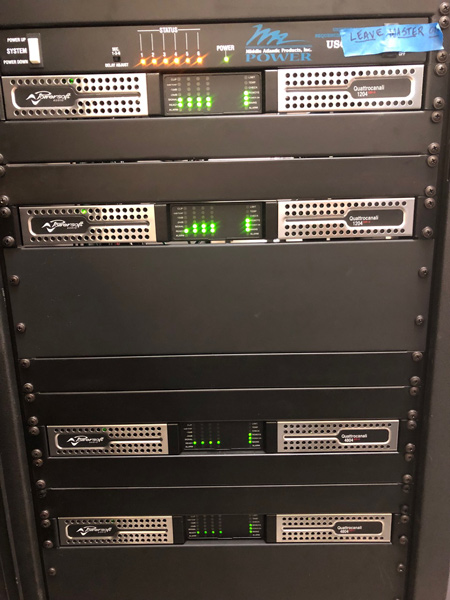 Rack with four Quattrocanali amplifiers under a Middle Atlantic power unit