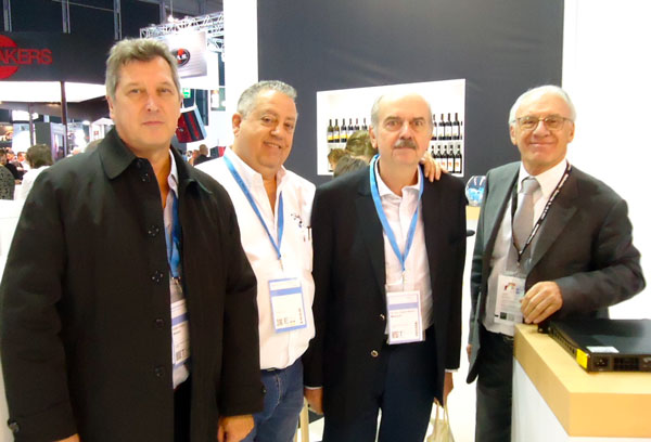 Four men with visitor badges at a stand at Prolight + Sound 2017
