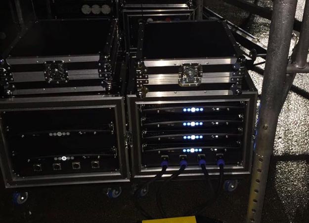 Rack cases with Powersoft X4 amplifiers, front LEDs lit, during the PMM training in Miami