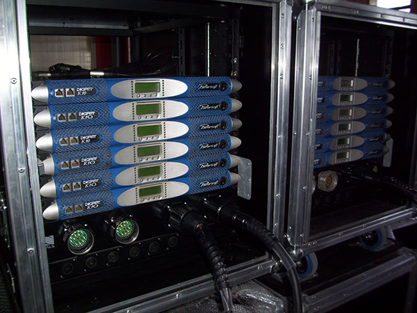 Rack cases with blue Powersoft K10 amplifiers at Lollapalooza Argentina