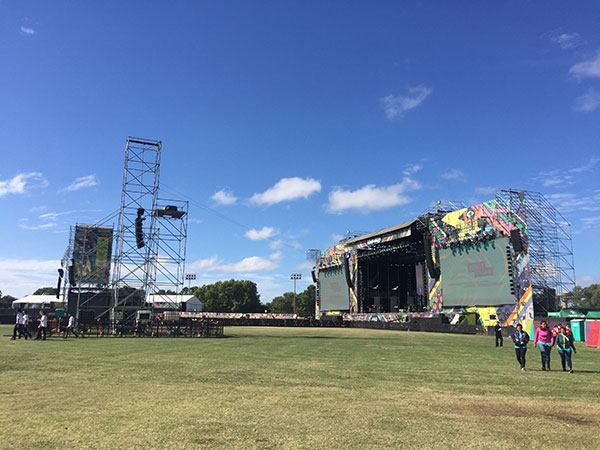 Lollapalooza Argentina main stage and a delay tower seen across the festival field