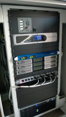 Rack with a MediaMatrix NION processor, a Powersoft M Series amplifier and three Ottocanali amplifiers