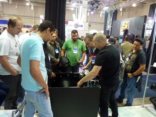 Visitors gathered around the M-Force demonstration unit at AES Brasil Expo