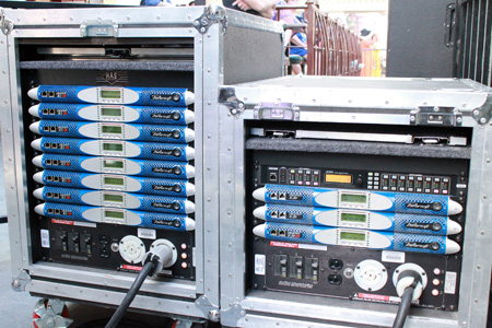 Two touring racks with Powersoft K Series amplifiers, one also holding a processor