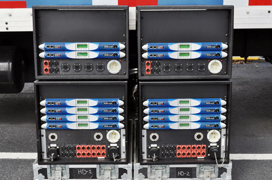 Four amplifier racks labeled HD-1 and HD-2, holding twelve Powersoft K Series amplifiers