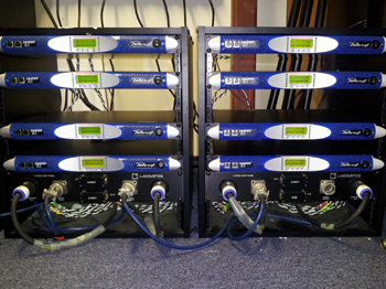 Two racks with eight Powersoft K3 amplifiers and L-Acoustics connector panels