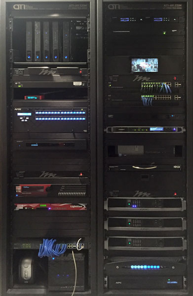 Two equipment racks at Sake Rok holding audio, video and network devices