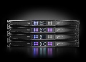 Four T Series amplifiers stacked on a black background, front panels lit
