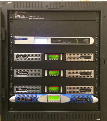 Rack with a Symetrix Radius processor, three Powersoft Duecanali amplifiers and a K10 amplifier