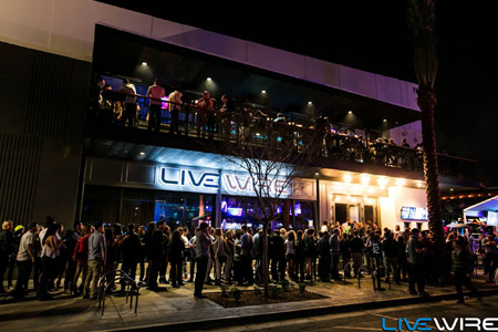 Crowd outside the Livewire club at night, with more people on the upper terrace
