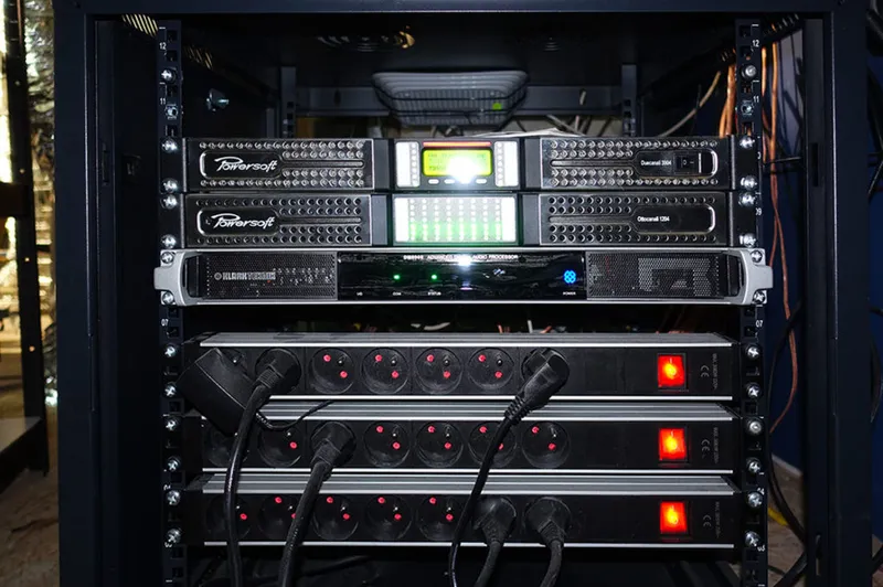 Rack with a Duecanali 3004 and an Ottocanali 1204 above a Klark Teknik processor and three power strips