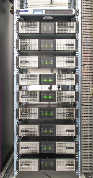 Rack of Powersoft Ottocanali amplifiers at the Parc Olympique Lyonnais stadium